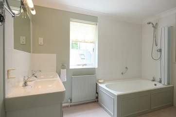 The en suite bathroom to Bedroom 2 has twin basins.