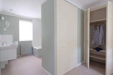The dressing-room to the master bedroom. Plenty of space to fit a cot if required.