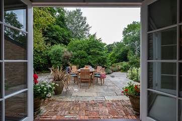 French doors open from the sitting-room to the terrace and garden.