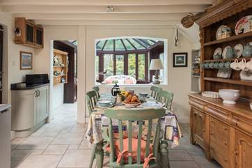 The kitchen/breakfast-room opens into the sociable conservatory.