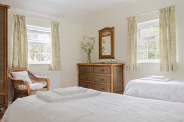 This twin bedroom has a colonial feel (Bedroom 4).