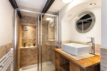 The downstairs shower-room, is perfect to wash away the sand.