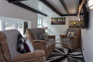 The little sitting-room is very bijou, but very comfy.