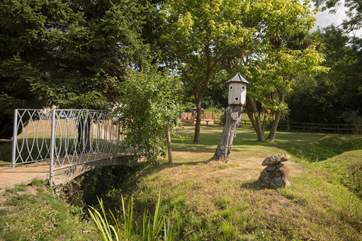 A small stream runs through the bottom of the garden
