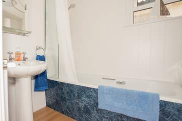 The ground floor bathroom with bath and shower over