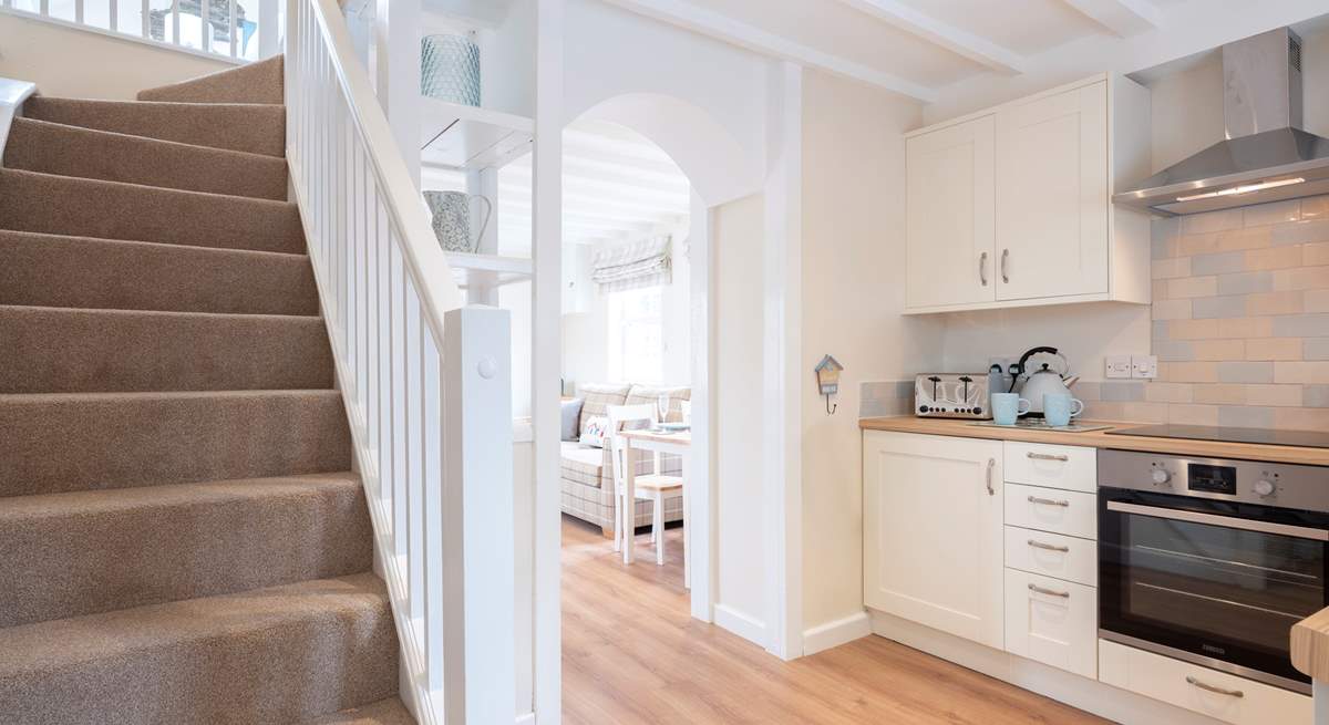 The stairs lead up to the open bedroom.