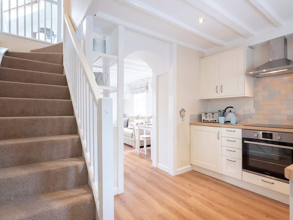 The stairs lead up to the open bedroom.