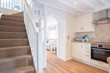The stairs lead up to the open bedroom.