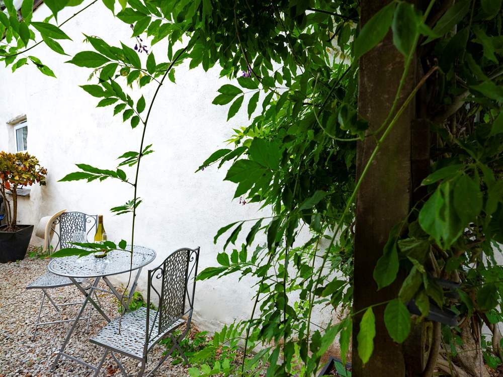There is a tiny area to sit out at the side of the cottage.