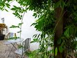 There is a tiny area to sit out at the side of the cottage.