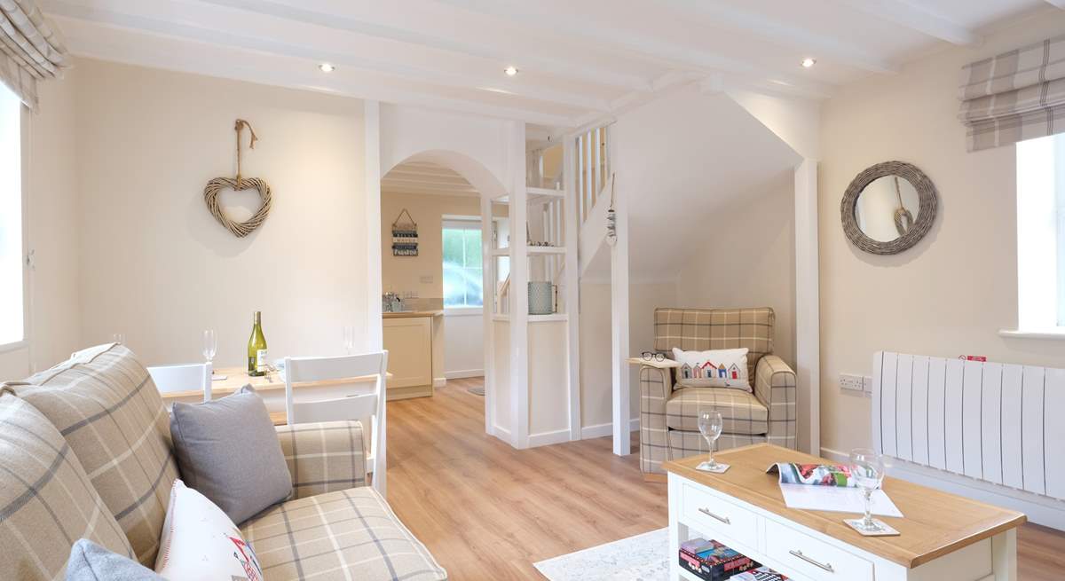 Coastal colours in the open plan sitting/dining-room.