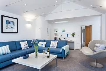 The relaxing living room is beautifully light and airy.