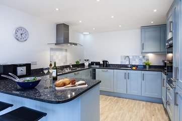 The stylish kitchen is fabulously equipped.