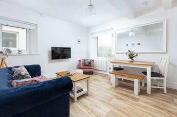 The living-area is the perfect place to relax and has beautiful sea views.