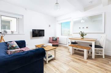 The living-area is the perfect place to relax with a glimpse of the sea.