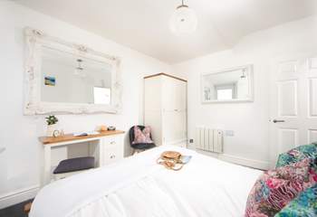 The bedroom has been lovingly furnished.