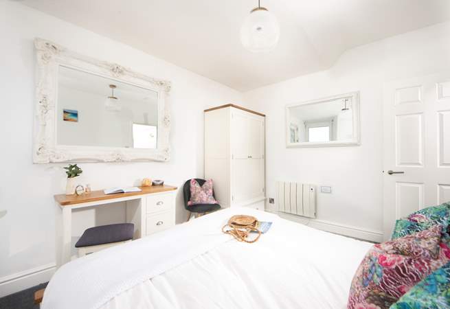 The bedroom has been lovingly furnished.