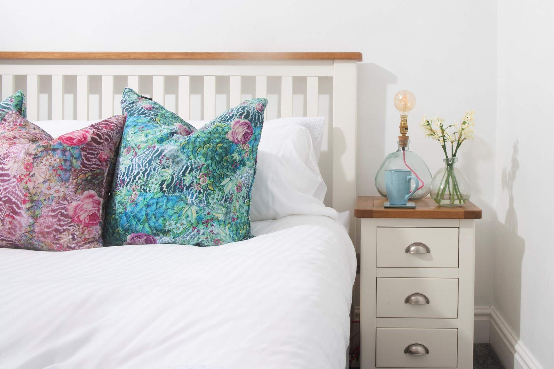 The bedroom is light and modern.