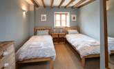 Bedroom 3 is home to these delightful twin beds. - Thumbnail Image