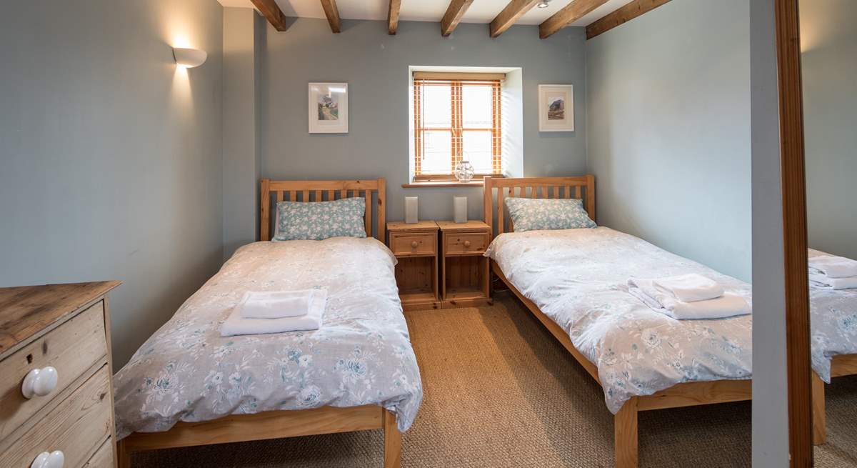 Bedroom 3 is home to these delightful twin beds.