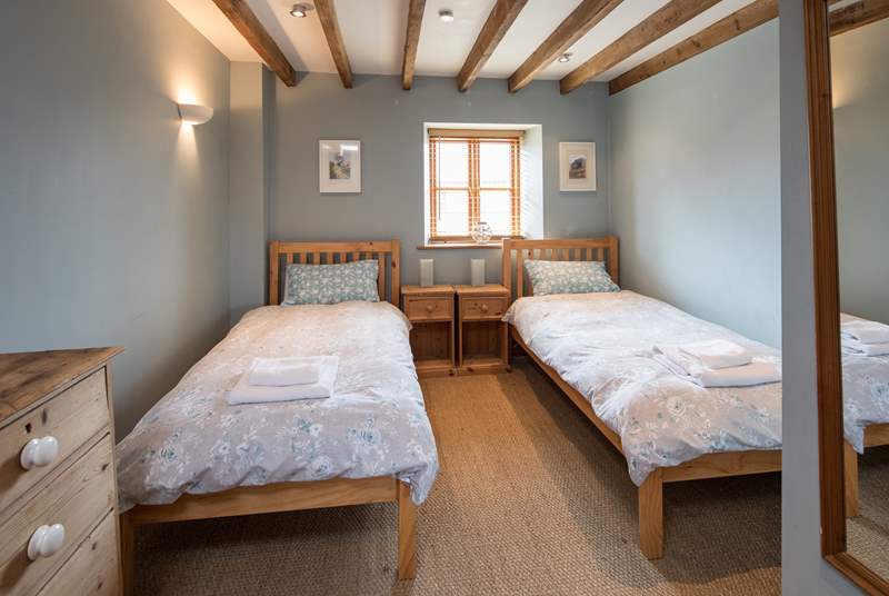 Bedroom 3 is home to these delightful twin beds.