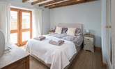 Bedroom 2 is a beautiful light and airy bedroom which leads out onto an enclosed courtyard and is home to a rather inviting king-size bed. - Thumbnail Image