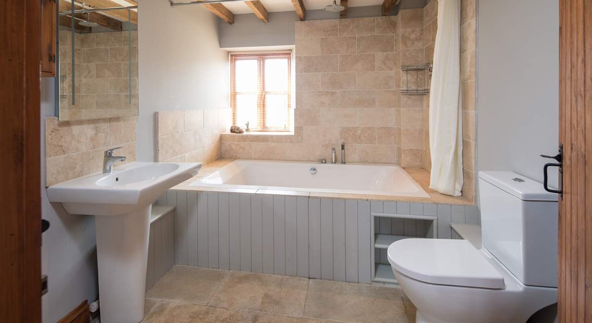 The en suite to the master bedroom boasts this fabulous double bath. Perfect for relaxing in after a hard day of fun and games.