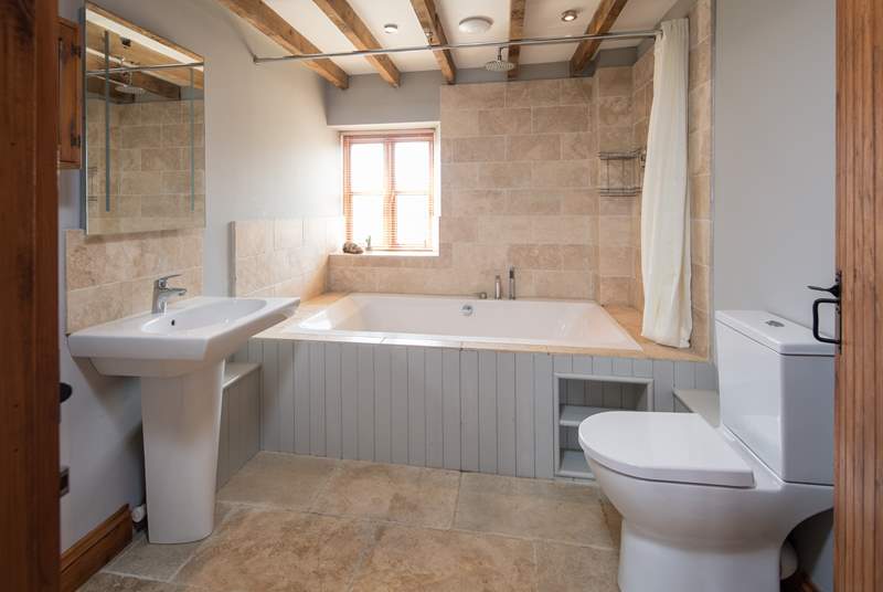 The en suite to the master bedroom boasts this fabulous double bath. Perfect for relaxing in after a hard day of fun and games.