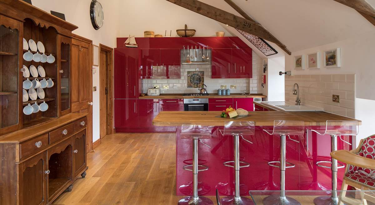 The breakfast bar offers a second area to sit and dine. The open plan layout of this property is perfect for celebrating your holiday time together.