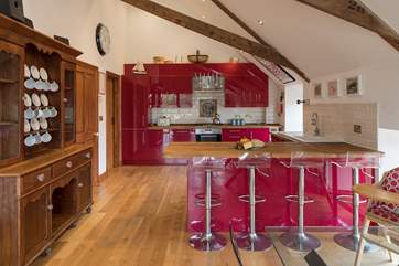 The breakfast bar offers a second area to sit and dine. The open plan layout of this property is perfect for celebrating your holiday time together.