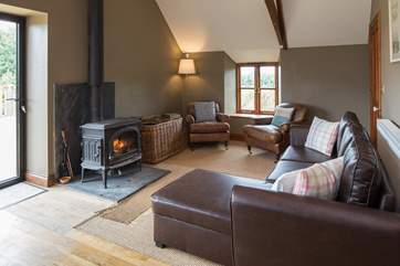 Cosying up in front of the wood-burner in the evening is the perfect way to end the day.