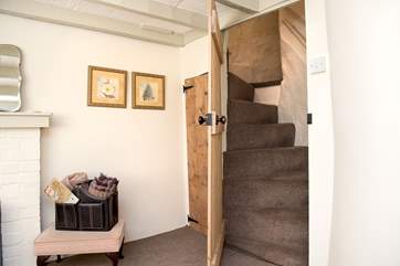 A doorway in the snug opens up to reveal the spiral staircase leading to Bedroom 2.
Please note the stairs are steeper owing to the age of the cottage.