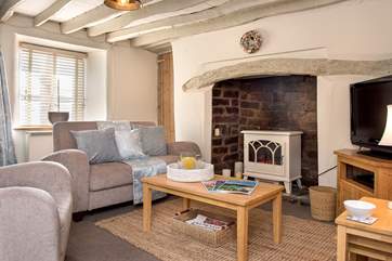 On chillier evenings snuggle up in front of the wood-burner effect electric stove - which has all the charm of the real thing but without the hassle!