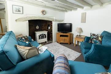 On chillier evenings snuggle up in front of the wood-burner effect electric stove - which has all the charm of the real thing but without the hassle!