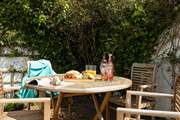 Enjoy a morning coffee or afternoon tea in the sheltered courtyard