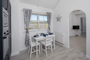 This pleasant dining-area is a lovely spot to enjoy your evening meal together.