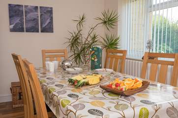 A second television and soft seating in the dining-room, everyone can enjoy their own space