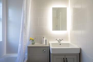 The family bathroom with shower over the bath.