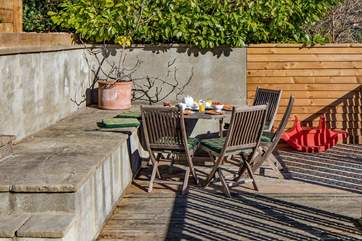 A lovely suntrap in the garden to enjoy some al fresco dining.