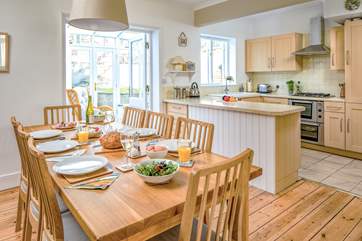 The dining-area has plenty of space to seat eight people at the table.