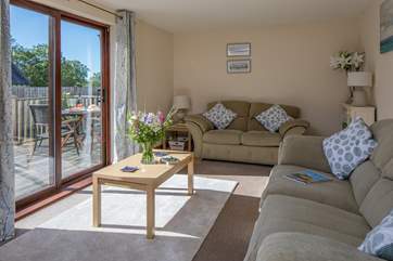 The sitting-room is super comfy, and opens directly onto your decked patio area.