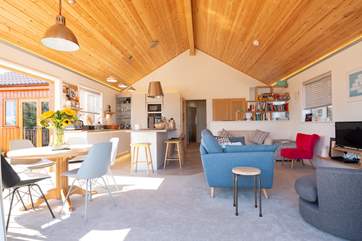 Light streams into the spacious open plan living room.