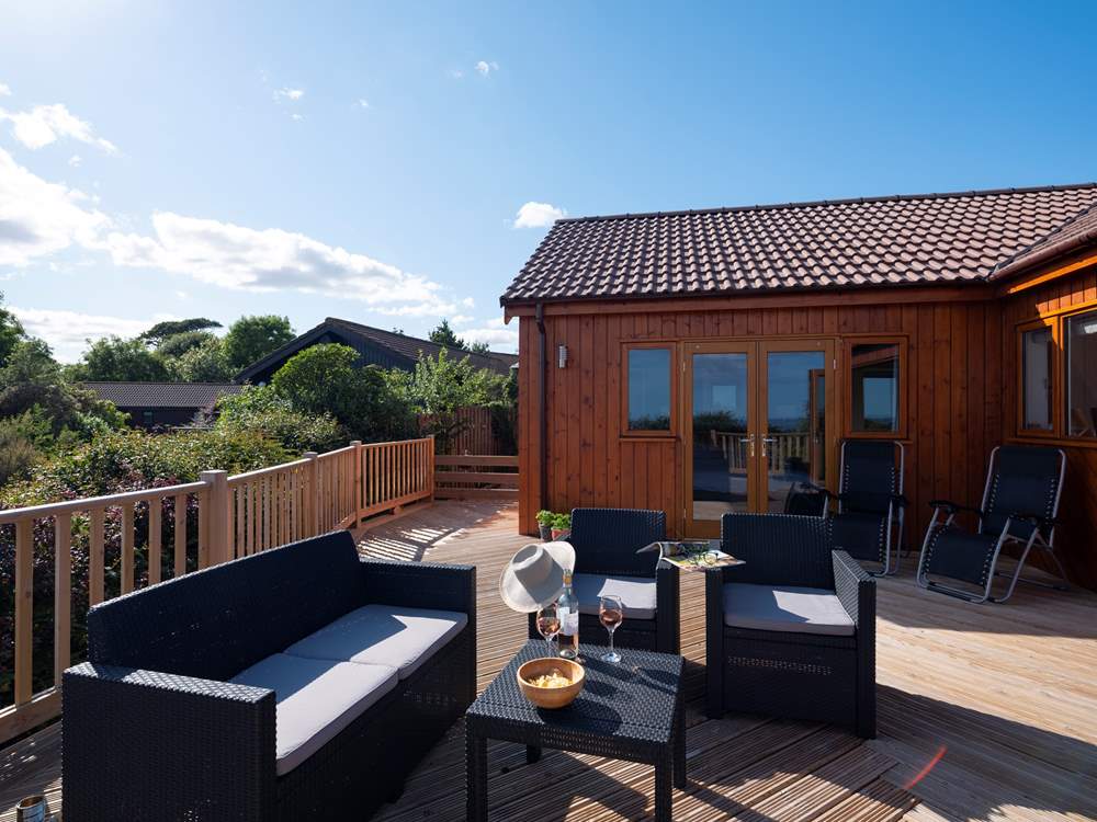 The master bedroom also has bi-fold doors that open onto the deck.
