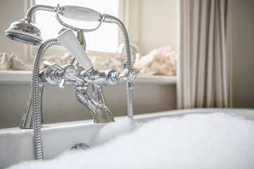 You will most definitely enjoy relaxing in this roll-top bath!