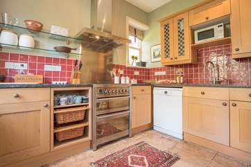 The flagstone flooring runs through into the kitchen.