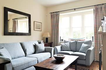 Open plan sitting/dining-room with patio doors leading to the pretty patio area (The first of two sitting-rooms).