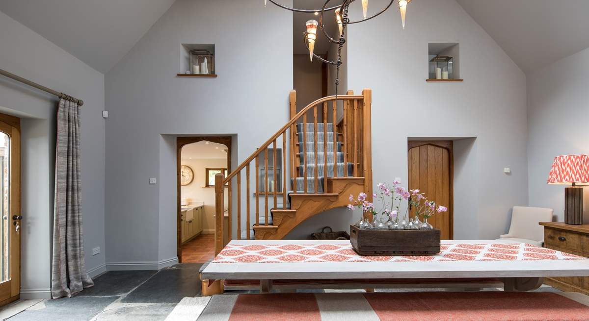 Looking through the dining-room. With the kitchen to the left, bedroom one and en suite to the right and the master staircase to the first floor rooms.