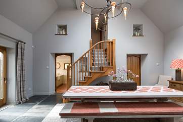 Looking through the dining-room. With the kitchen to the left, bedroom one and en suite to the right and the master staircase to the first floor rooms.