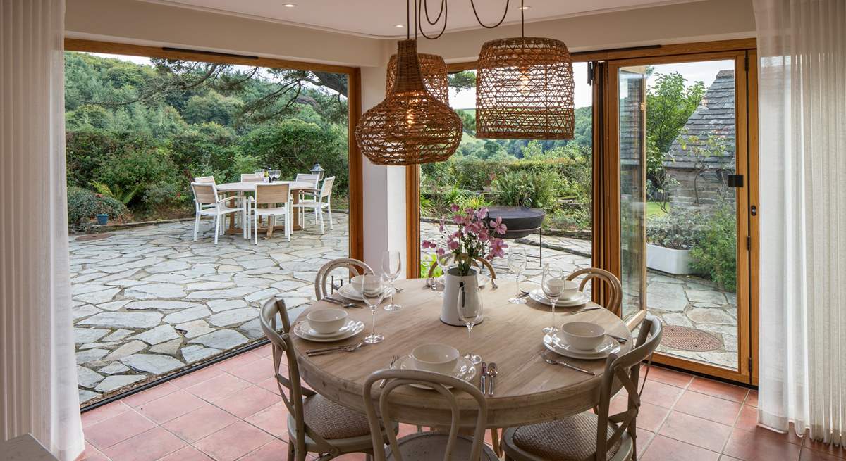 The fabulous bi-fold doors fully open to enhance your dining experience to the maximum.