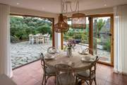 The fabulous bi-fold doors fully open to enhance your dining experience to the maximum.